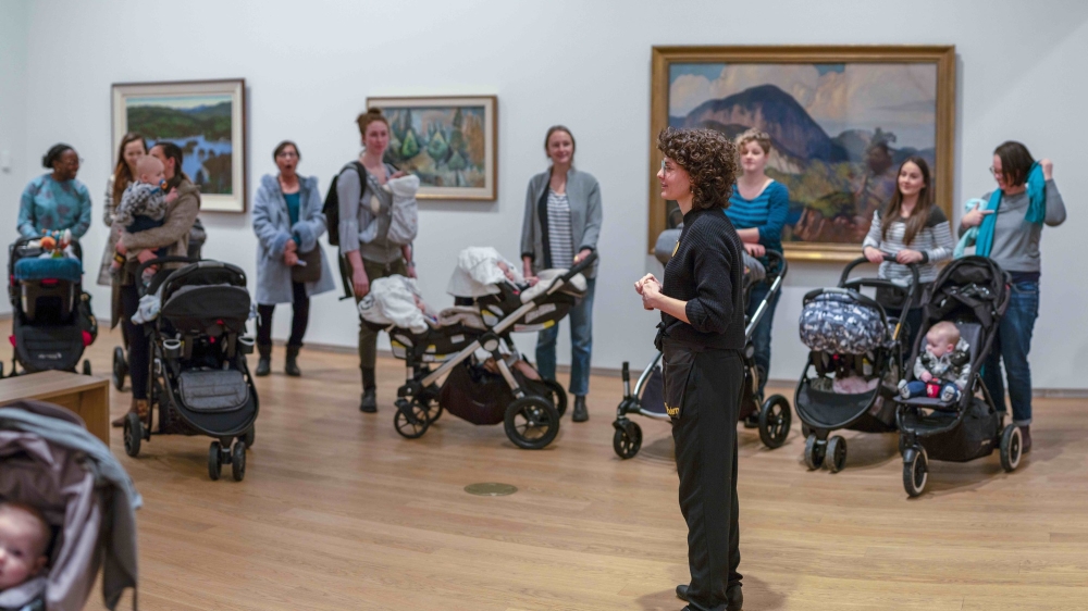 Museum stroller tour taking place in a gallery