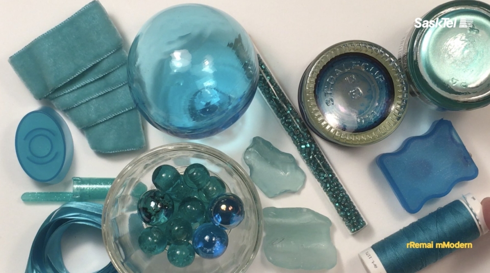 Various blue glass objects arranged on a table