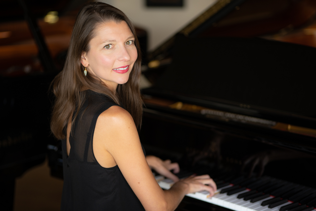 Portrait of Sofia Mycyk sitting at a Piano