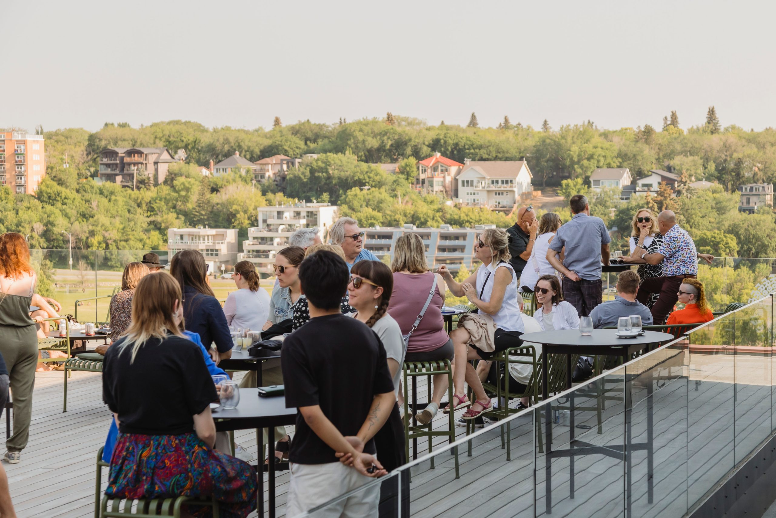 People socialize on Remai Modern's rooftop, which overlooks the South Saskatchewan river valley.