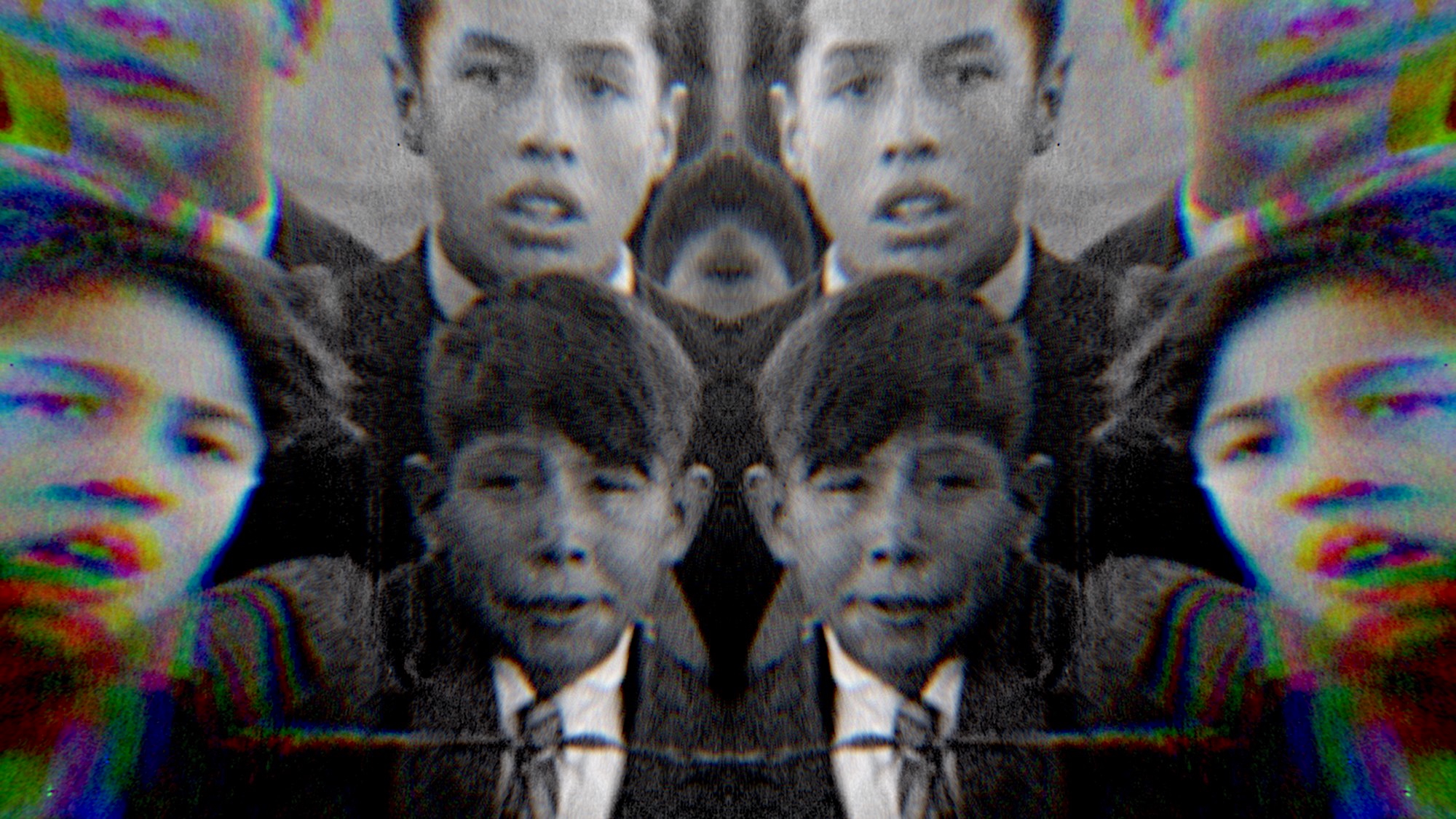 Digitally manipulated black-and-white image of young boys wearing suits and ties. The photo is mirrored horizontally and vertically, creating a kaleidoscopic effect that duplicates their faces across the frame. The image has a grainy texture and rainbow-coloured chromatic aberration around the edges, giving it a distorted, surreal quality.